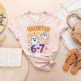 Haunted 67 Ghost Math Teacher Halloween Costume Math Pun Women's Heather T-Shirt Heather Peach