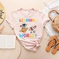 Learning Is Out Of This World Space Back To School Teacher Women's Heather T-Shirt Heather Peach Learning Is Out Of This World Space Back To School Teacher Women's Heather T-Shirt Heather Peach