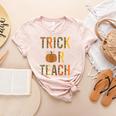 Leopard Trick Or Teach Halloween Teacher Costume Women Women's Heather T-Shirt Heather Peach