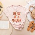 School Teachers Day The Life Of A Teacher Teaching Women's Heather T-Shirt Heather Peach School Teachers Day The Life Of A Teacher Teaching Women's Heather T-Shirt Heather Peach