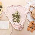 Skeleton Book Floral Skull Halloween Teacher Costume Women's Heather T-Shirt Heather Peach Skeleton Book Floral Skull Halloween Teacher Costume Women's Heather T-Shirt Heather Peach