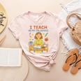I Teach In My Pajamas Crayon Home School Teacher PJs Women's Heather T-Shirt Heather Peach