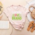 Teachers Love Brains Halloween Teacher Zombie Women's Heather T-Shirt Heather Peach