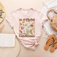We All Thrive Under Different Conditions SPED Teacher Women's Heather T-Shirt Heather Peach We All Thrive Under Different Conditions SPED Teacher Women's Heather T-Shirt Heather Peach
