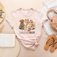 Trick Or Teach Groovy Teacher Halloween Floral Ghost Women's Heather T-Shirt Heather Peach Trick Or Teach Groovy Teacher Halloween Floral Ghost Women's Heather T-Shirt Heather Peach