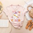 Trick Or Teach Groovy Teacher Halloween Retro Ghost Women's Heather T-Shirt Heather Peach