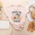 Trick Or Teach Teacher Women's Heather T-Shirt Heather Peach Trick Or Teach Teacher Women's Heather T-Shirt Heather Peach