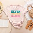 Never Underestimate A Public School Teacher Groovy Women Women's Heather T-Shirt Heather Peach