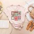 Vintage Preppy Very Merry Teacher Santa Stamps Christmas Women's Heather T-Shirt Heather Peach Vintage Preppy Very Merry Teacher Santa Stamps Christmas Women's Heather T-Shirt Heather Peach