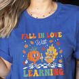 Groovy Fall In Love With Learning Autumn Pumpkin Teacher Women's Heather T-Shirt Heather True Royal