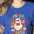 Groovy Halloween Trick Or Teach Retro Floral Ghost Teacher For Men Women Kids Women's Heather T-Shirt Heather True Royal Groovy Halloween Trick Or Teach Retro Floral Ghost Teacher For Men Women Kids Women's Heather T-Shirt Heather True Royal