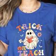 Groovy Halloween Trick Or Teach Retro Floral Ghost Teacher Women's Heather T-Shirt Heather True Royal Groovy Halloween Trick Or Teach Retro Floral Ghost Teacher Women's Heather T-Shirt Heather True Royal