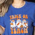 Groovy Teacher Halloween Trick Or Teach Ghost Men Women Kids Women's Heather T-Shirt Heather True Royal