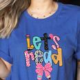 Lets Read Reading Teacher Back To School Literacy Pencil Bow Women's Heather T-Shirt Heather True Royal Lets Read Reading Teacher Back To School Literacy Pencil Bow Women's Heather T-Shirt Heather True Royal