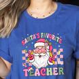 Santa's Favorite Teacher Groovy Christmas Teacher Boys Girls Women's Heather T-Shirt Heather True Royal Santa's Favorite Teacher Groovy Christmas Teacher Boys Girls Women's Heather T-Shirt Heather True Royal