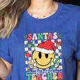 Santas Favorite Teacher Retro Groovy Smile Face Christmas Women's Heather T-Shirt Heather True Royal Santas Favorite Teacher Retro Groovy Smile Face Christmas Women's Heather T-Shirt Heather True Royal