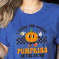 I Teach The Cutest Pumpkins In The Patch Groovy Teacher Fall Women's Heather T-Shirt Heather True Royal