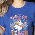 Trick Or Teach Groovy Teacher Halloween Retro Ghost Women's Heather T-Shirt Heather True Royal