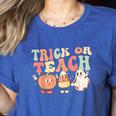 Trick Or Teach Pumpkin Candy Corn Ghost Halloween Teacher Women's Heather T-Shirt Heather True Royal