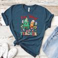 One Merry Teacher Groovy Christmas Tree Pjs Xmas Teacher Women's Heather T-Shirt Heather Deep Teal