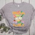 Dinosaurs Didn't Read Now They Are Extinct Reading Teacher Women's Heather T-Shirt Athletic Heather Dinosaurs Didn't Read Now They Are Extinct Reading Teacher Women's Heather T-Shirt Athletic Heather