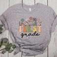 First Grade Teacher Wildflower Back To School Floral Outfits Women's Heather T-Shirt Athletic Heather First Grade Teacher Wildflower Back To School Floral Outfits Women's Heather T-Shirt Athletic Heather