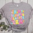 In My Glowing Teacher Era Teaching Back To School Women's Heather T-Shirt Athletic Heather In My Glowing Teacher Era Teaching Back To School Women's Heather T-Shirt Athletic Heather