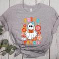 Groovy Halloween Trick Or Teach Retro Floral Ghost Teacher For Men Women Kids Women's Heather T-Shirt Athletic Heather Groovy Halloween Trick Or Teach Retro Floral Ghost Teacher For Men Women Kids Women's Heather T-Shirt Athletic Heather