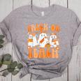 Groovy Teacher Halloween Trick Or Teach Ghost Men Women Kids Women's Heather T-Shirt Athletic Heather