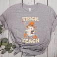 Halloween Teacher Shirts Women School Trick Or Teach Groovy Women's Heather T-Shirt Athletic Heather
