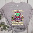 Halloween Teacher Zombie Reading Is Good For Brains Women's Heather T-Shirt Athletic Heather Halloween Teacher Zombie Reading Is Good For Brains Women's Heather T-Shirt Athletic Heather