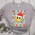 Santas Favorite Teacher Retro Groovy Smile Face Christmas Women's Heather T-Shirt Athletic Heather Santas Favorite Teacher Retro Groovy Smile Face Christmas Women's Heather T-Shirt Athletic Heather