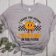 I Teach The Cutest Pumpkins In The Patch Groovy Teacher Fall Women's Heather T-Shirt Athletic Heather