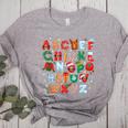 Teacher Christmas Alphabet Back To School Holiday Learning Women's Heather T-Shirt Athletic Heather Teacher Christmas Alphabet Back To School Holiday Learning Women's Heather T-Shirt Athletic Heather
