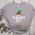 The Teacher Elf Matching Family Christmas Women's Heather T-Shirt Athletic Heather