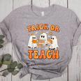 Teacher Halloween Trick Or Teach Retro Groovy Floral Ghost Women's Heather T-Shirt Athletic Heather Teacher Halloween Trick Or Teach Retro Groovy Floral Ghost Women's Heather T-Shirt Athletic Heather