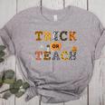 Trick Or Teach Funny School Teacher Halloween Costume Women's Heather T-Shirt Athletic Heather