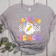 Trick Or Teach Groovy Halloween Teachers Women's Heather T-Shirt Athletic Heather Trick Or Teach Groovy Halloween Teachers Women's Heather T-Shirt Athletic Heather