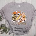 Trick Or Teach Groovy Teacher Halloween Floral Ghost Women's Heather T-Shirt Athletic Heather Trick Or Teach Groovy Teacher Halloween Floral Ghost Women's Heather T-Shirt Athletic Heather