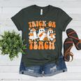 Groovy Teacher Halloween Trick Or Teach Ghost Men Women Kids Women's Heather T-Shirt Heather Forest
