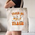 Teacher Halloween Trick Or Teach Retro Groovy Floral Ghost Canvas Tote Bag, novelty gifts, funny gifts Teacher Halloween Trick Or Teach Retro Groovy Floral Ghost Canvas Tote Bag, novelty gifts, funny gifts