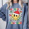 Santas Favorite Teacher Retro Groovy Smile Face Christmas Comfort Colors Sweatshirt Blue Jean Santas Favorite Teacher Retro Groovy Smile Face Christmas Comfort Colors Sweatshirt Blue Jean