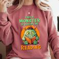 Halloween Teacher Librarian Monster Reading Books Men Women Kids Comfort Colors Sweatshirt Crimson