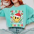 Santas Favorite Teacher Retro Groovy Smile Face Christmas Comfort Colors Sweatshirt Chalky Mint Santas Favorite Teacher Retro Groovy Smile Face Christmas Comfort Colors Sweatshirt Chalky Mint