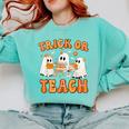 Teacher Halloween Trick Or Teach Retro Groovy Floral Ghost Comfort Colors Sweatshirt Chalky Mint Teacher Halloween Trick Or Teach Retro Groovy Floral Ghost Comfort Colors Sweatshirt Chalky Mint