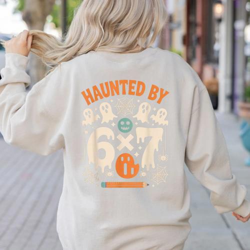 Haunted By 6x7 Math Teacher Halloween Pun Women's Sweatshirt Back Print - teacherstshirts.com