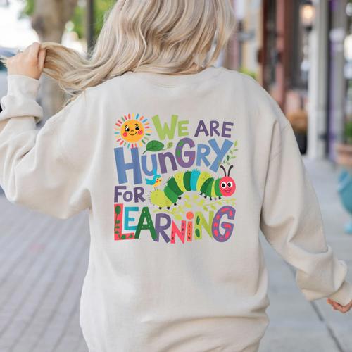 We Are Hungry For Learning Teacher Life Back To School Women's Sweatshirt Back Print - teacherstshirts.com CA