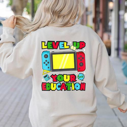 Level Up Your Education Gaming Inspired Teacher Gamers Women's Sweatshirt Back Print - teacherstshirts.com CA
