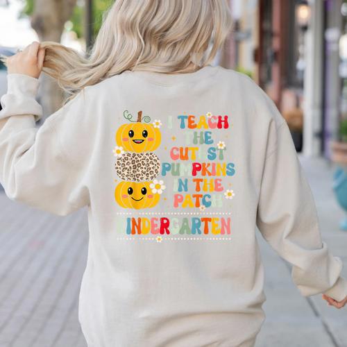I Teach The Cutest Pumpkins Kindergarten Teacher Halloween Women's Sweatshirt Back Print - teacherstshirts.com