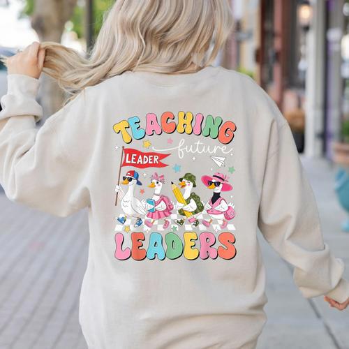 Teaching Future Leaders Groovy Teacher Back To School Women's Sweatshirt Back Print - teacherstshirts.com CA